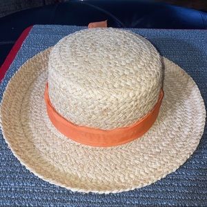 Summer straw hat with orange trim ribbon and bow